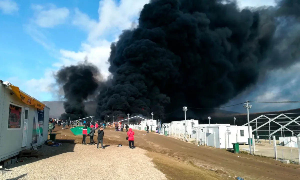 Smoke rises from a fire at migrant camp Lipa, near Bihac in western Bosnia on Dec. 23, 2020. (Hasan Arnautovic/AP Photo)