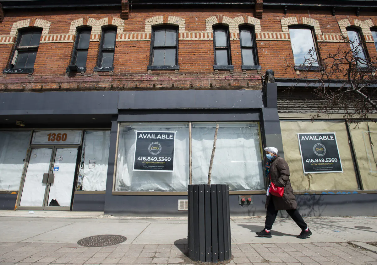 Signs indicating space available are seen on storefronts amid COVID-19 lockdowns on Queen Street in Toronto on April 16, 2020. (The Canadian Press/Nathan Denette)