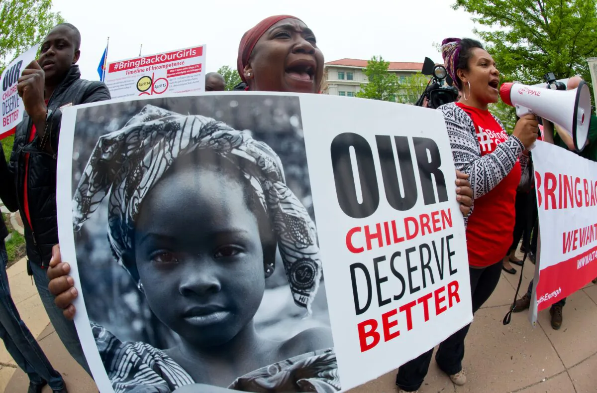 Demonstrators protest regarding the kidnapping of 276 girls by terror group Boko Haram in front of the Embassy of Nigeria in Washington on May 14, 2014. (Karen Bleier/AFP via Getty Images)
