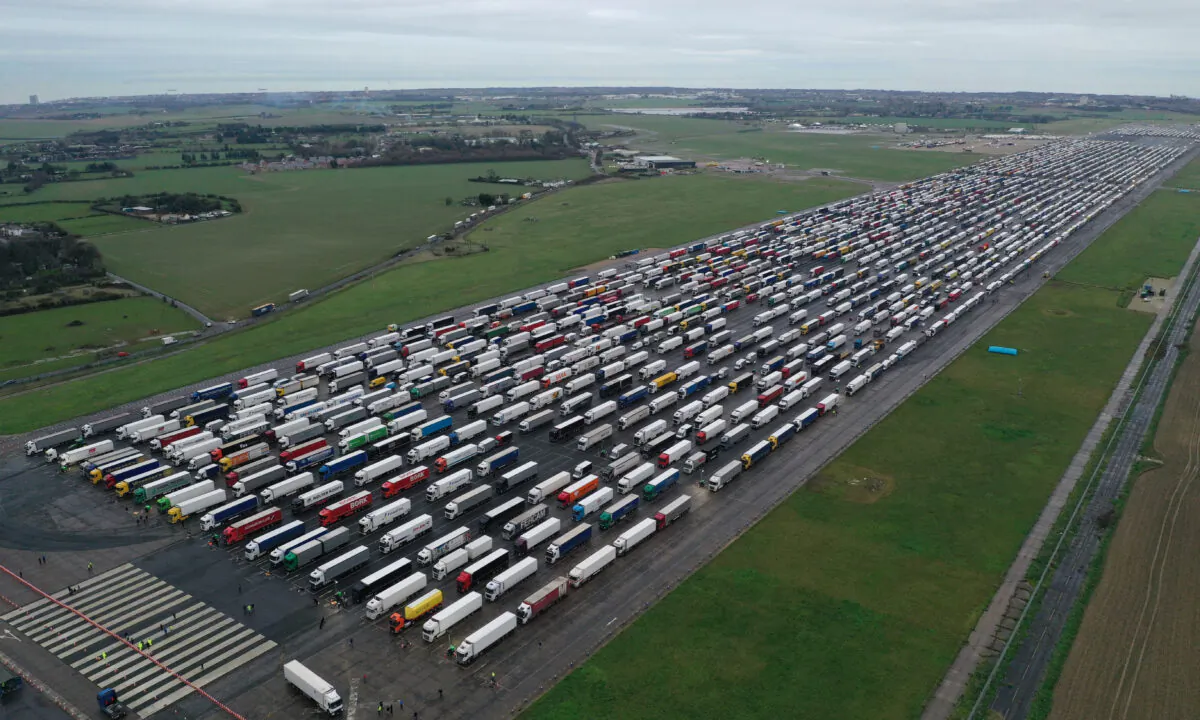 Lorries are parked on the runway at Manston airport at sunrise as part of Operation Brock to stack lorries waiting to cross the English Channel in Kent, England, on Dec. 22, 2020. 
 (Dan Kitwood/Getty Images)