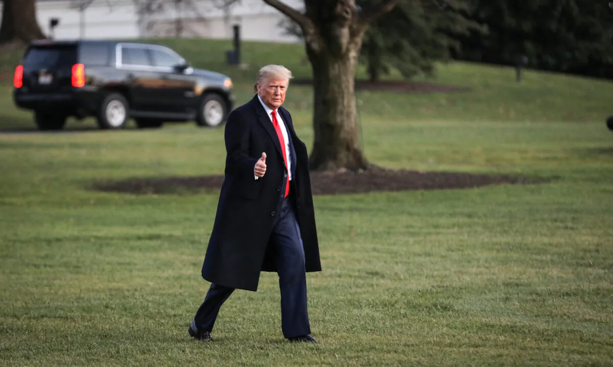 President Donald Trump walks on the South Lawn to board Marine One at the White House on Dec. 18, 2019. (Charlotte Cuthbertson/The Epoch Times)