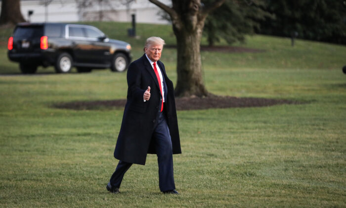 President Donald Trump walks on the South Lawn to board Marine One at the White House on Dec. 18, 2019. (Charlotte Cuthbertson/The Epoch Times)