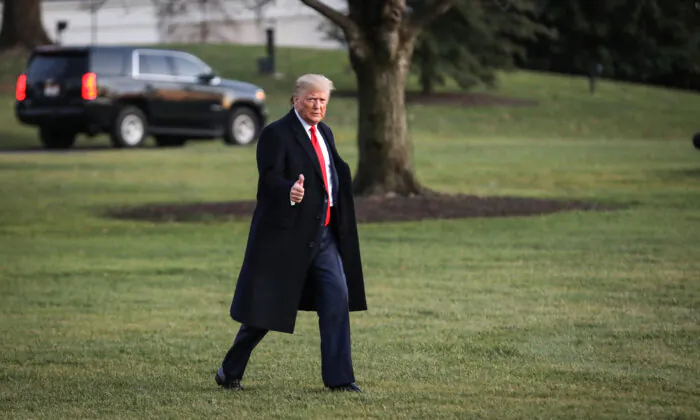 President Donald Trump walks on the South Lawn to board Marine One at the White House in Washington on Dec. 18, 2019. (Charlotte Cuthbertson/The Epoch Times)