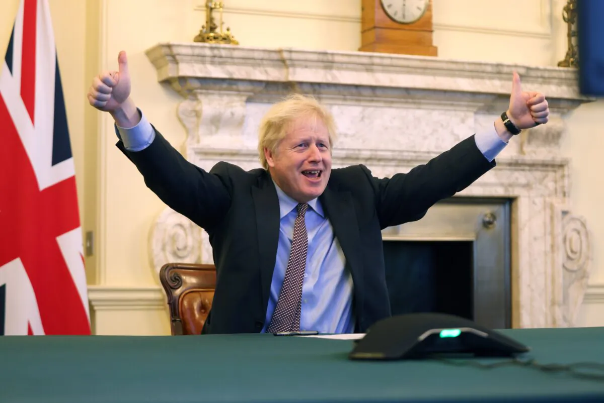 British Prime Minister Boris Johnson celebrates after reaching a deal with the EU on post-Brexit trade relations, in Downing Street, London, on Dec. 24, 2020. (UK Prime Minister's Office)