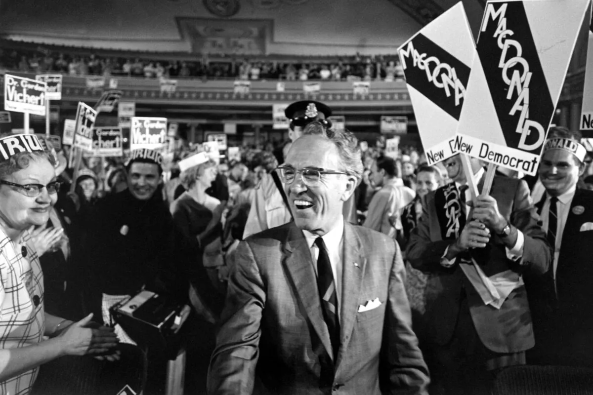 Tommy Douglas is surrounded by supporters as he arrives at the Palace Theatre to address an NDP rally in Hamilton, Ont., on June 11, 1968. (The Canadian Press)