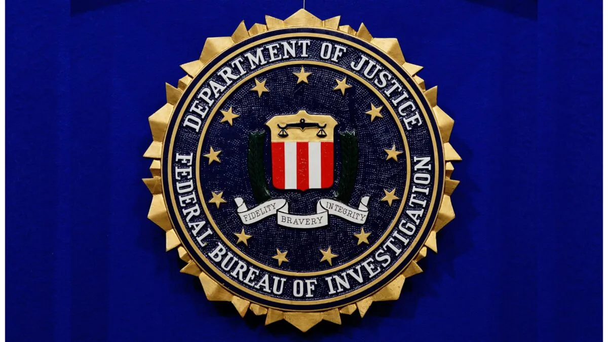 The Federal Bureau of Investigation (FBI) seal is seen on the lectern following a press conference announcing the FBI's 499th and 500th additions to the "Ten Most Wanted Fugitives" list on June 17, 2013 at the Newseum in Washington, DC. (Mandel Ngan/AFP via Getty Images)