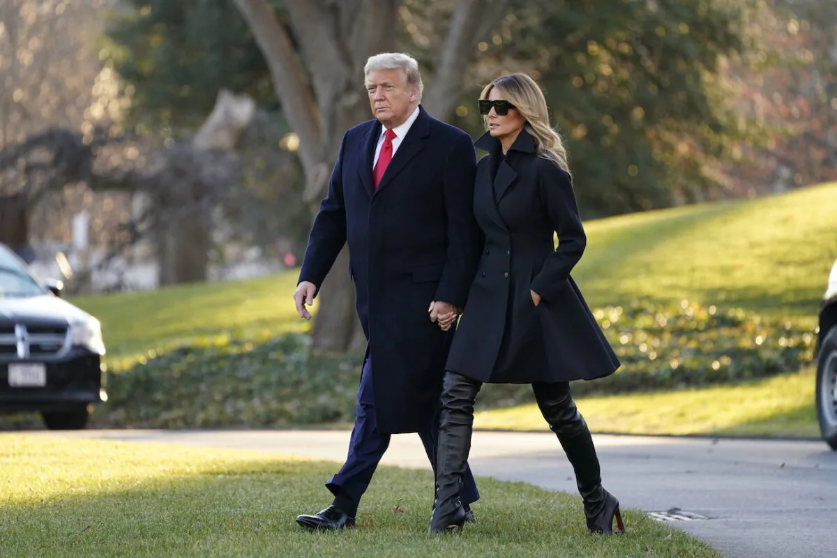 Then-President Donald Trump and then-first lady Melania Trump walk to board Marine One on the South Lawn of the White House, in Washington, on Dec. 23, 2020. (Evan Vucci/AP Photo)
