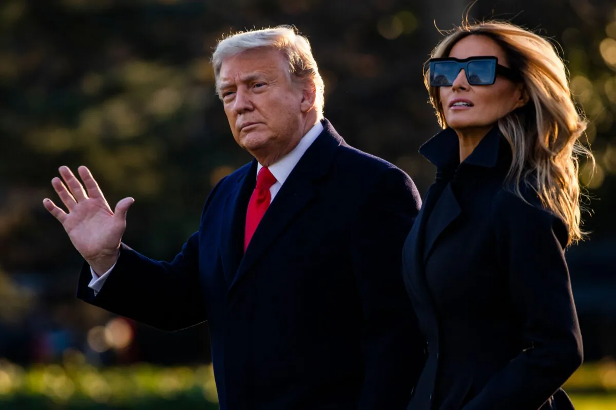 President Donald Trump and First Lady Melania Trump walk towards Marine One as they depart the White House en route to Mar-a-Lago, the President's private club, where they will spend Christmas and New Years Eve in Washington on Dec. 23, 2020. (Samuel Corum/AFP via Getty Images)