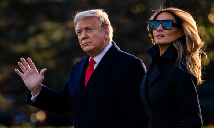 President Donald Trump and First Lady Melania Trump walk towards Marine One as they depart the White House en route to Mar-a-Lago, the President's private club, where they will spend Christmas and New Years Eve in Washington on Dec.23, 2020. (Samuel Corum/AFP via Getty Images)