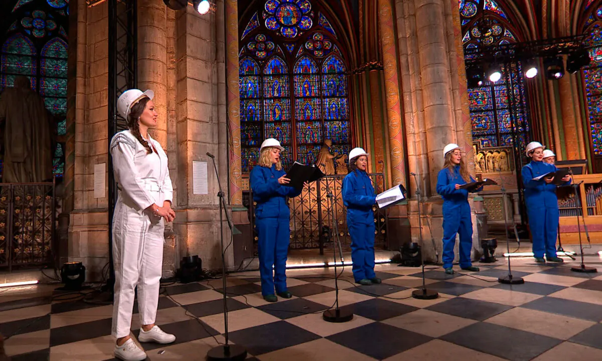 Soprani singer Julie Fuchs and the Notre Dame Cathedral choir recording a Christmas concert inside Notre Dame Cathedral in Paris, on Dec. 19, 2020. (MSNDP/Musique Sacree à Notre-Dame de Paris via AP)