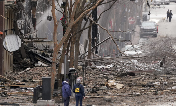 Emergency personnel work near the scene of an explosion in downtown Nashville, Tenn. on Dec. 25, 2020. (AP Photo/Mark Humphrey)