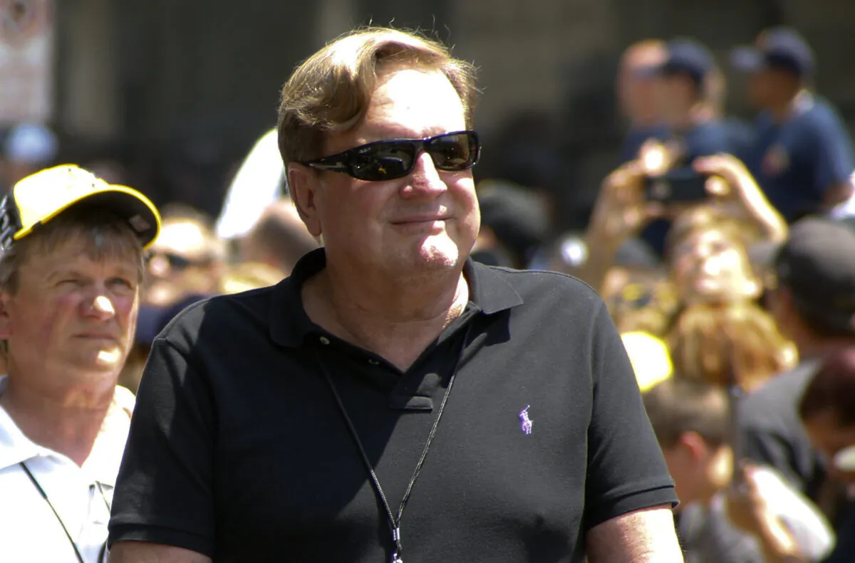 In this Wednesday, June 15, 2016, file photo, Ron Burkle rides along the victory parade route for the Pittsburgh Penguins NHL hockey team, in Pittsburgh. (Keith Srakocic/AP Photo, File)