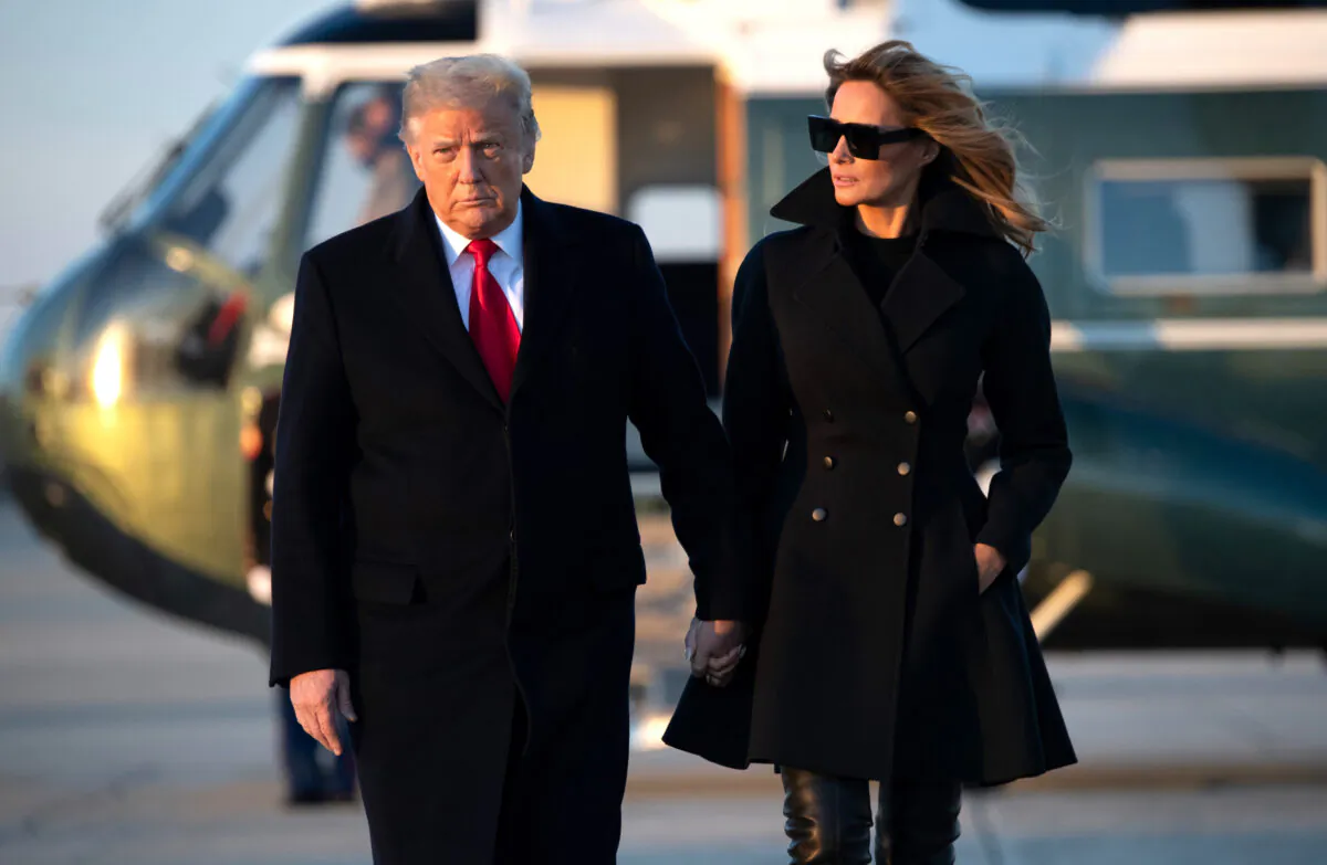 U.S. President Donald Trump and First Lady Melania Trump walk to board Air Force One prior to departure from Joint Base Andrews in Maryland as they travel to Mar-a-lago for Christmas and New Year's on Dec. 23, 2020. (SAUL LOEB/AFP via Getty Images)