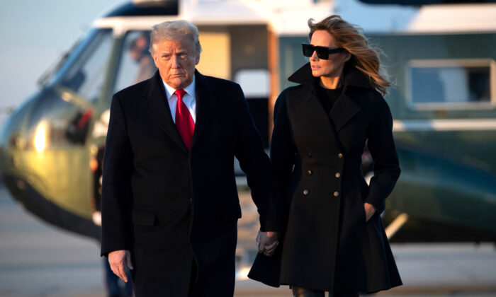 U.S. President Donald Trump and First Lady Melania Trump walk to board Air Force One prior to departure from Joint Base Andrews in Maryland as they travel to Mar-a-lago for Christmas and New Year's on Dec. 23, 2020. (SAUL LOEB/AFP via Getty Images)