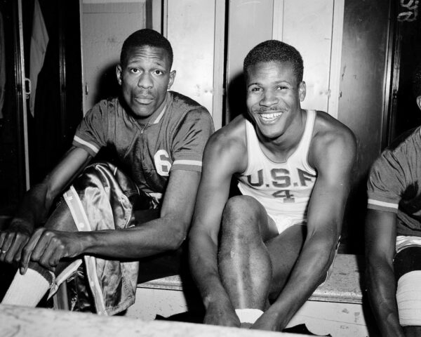 K.C. Jones, captain of the University of San Francisco Dons, right, is shown with teammate Bill Russell