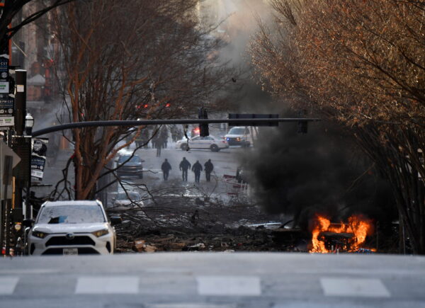 A vehicle burns near the site