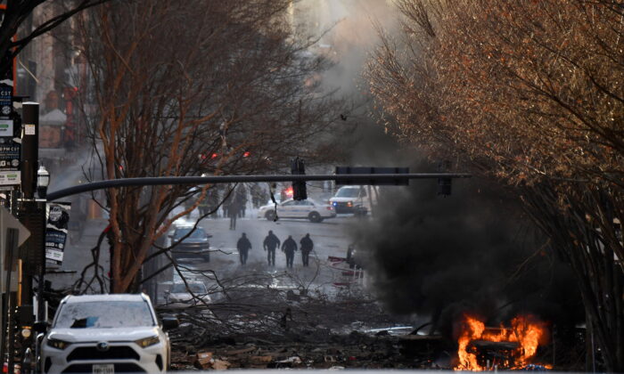 A vehicle burns near the site of an explosion in the area of Second and Commerce in Nashville, Tenn. on Dec. 25, 2020. (Andrew Nelles/Tennessean.com/USA TODAY NETWORK via REUTERS)