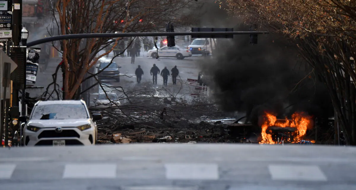 A vehicle burns near the site of an explosion in the area of Second and Commerce in Nashville, Tenn. on Dec. 25, 2020. (Andrew Nelles/Tennessean.com/USA TODAY NETWORK via REUTERS)