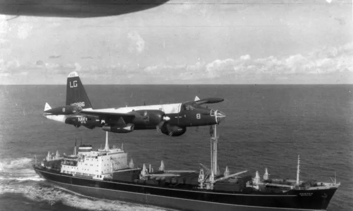  A U.S. patrol plane flies over a Soviet freighter during the Cuban missile crisis at the height of the Cold War in this 1962 photograph. (Getty Images)