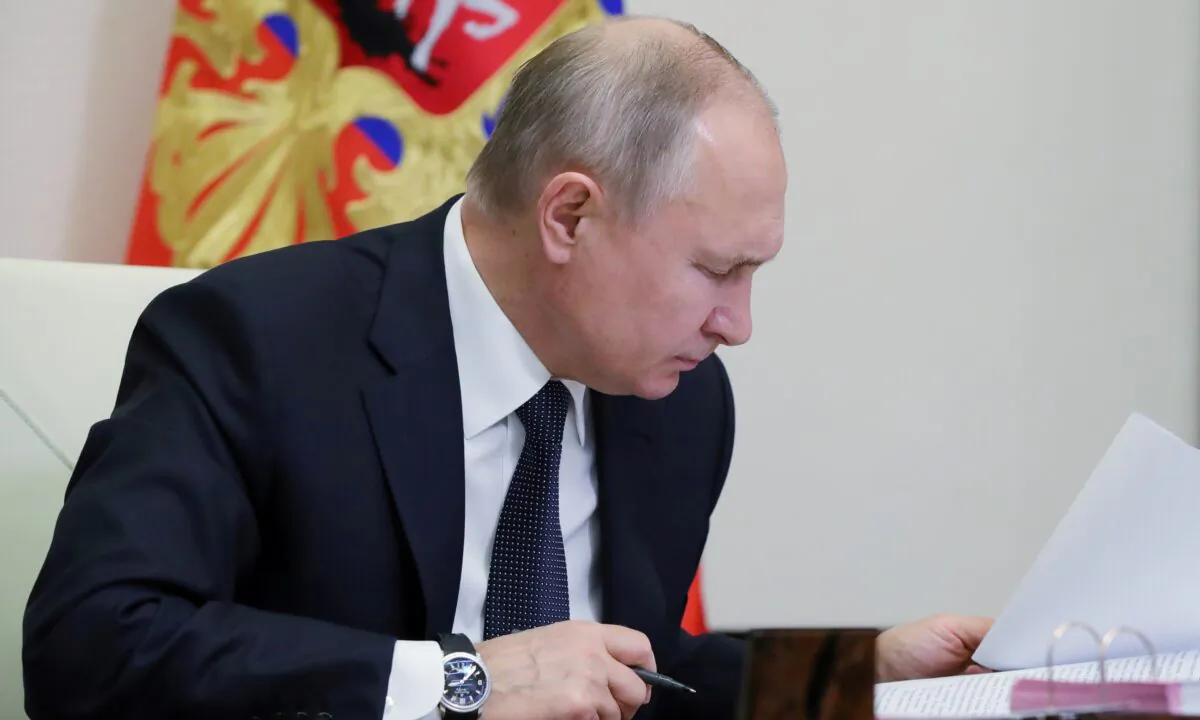 Russia's President Vladimir Putin chairs a joint meeting of the country's State Council and the Council for Strategic Development and National Projects via a video conference call at the Novo-Ogaryovo state residence outside Moscow, Russia, on Dec. 23, 2020. (Sputnik/Mikhail Klimentyev/Kremlin via Rruters)