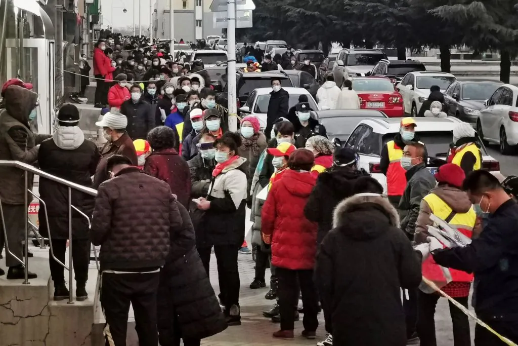 Residents wait to be tested for the novel coronavirus as the city carries out a mass testing program in Dalian, a city located in northeastern China's Liaoning province on Dec. 22, 2020. (STR/AFP via Getty Images)
