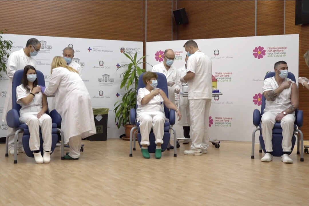 People receive COVID-19 vaccinations in this screengrab taken from a video, in Rome, Italy on Dec. 27, 2020. (Ministero della Salute/Handout via Reuters)