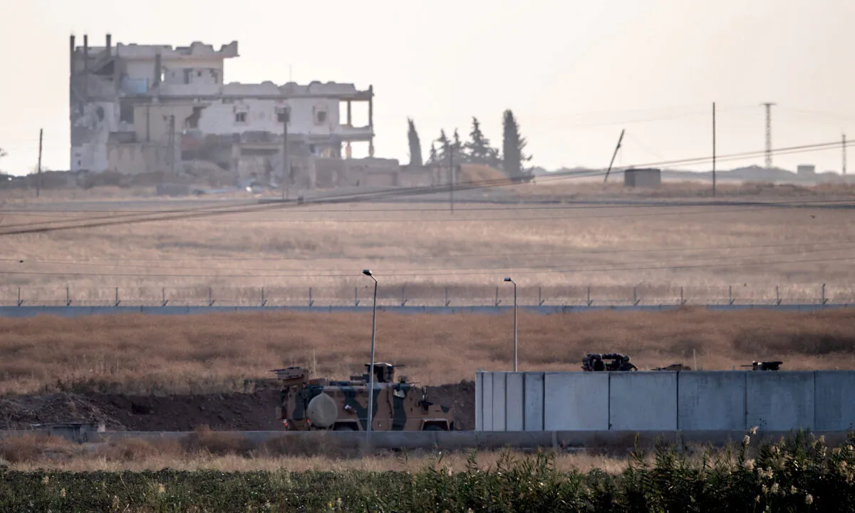 Turkish army vehicles drive towards the Syrian border near Akcakale in Sanliurfa province on Oct. 9, 2019. (Bulent Kilic/AFP via Getty Images)