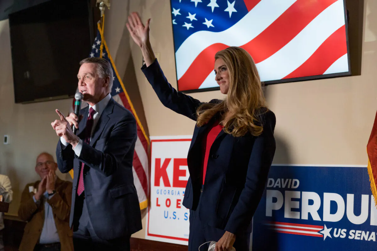 Sens David Perdue (R-Ga.) and Kelly Loeffler (R-Ga.) at a campaign event at a restaurant in Cumming, Ga., on Nov. 13, 2020. (Megan Varner/Getty Images).