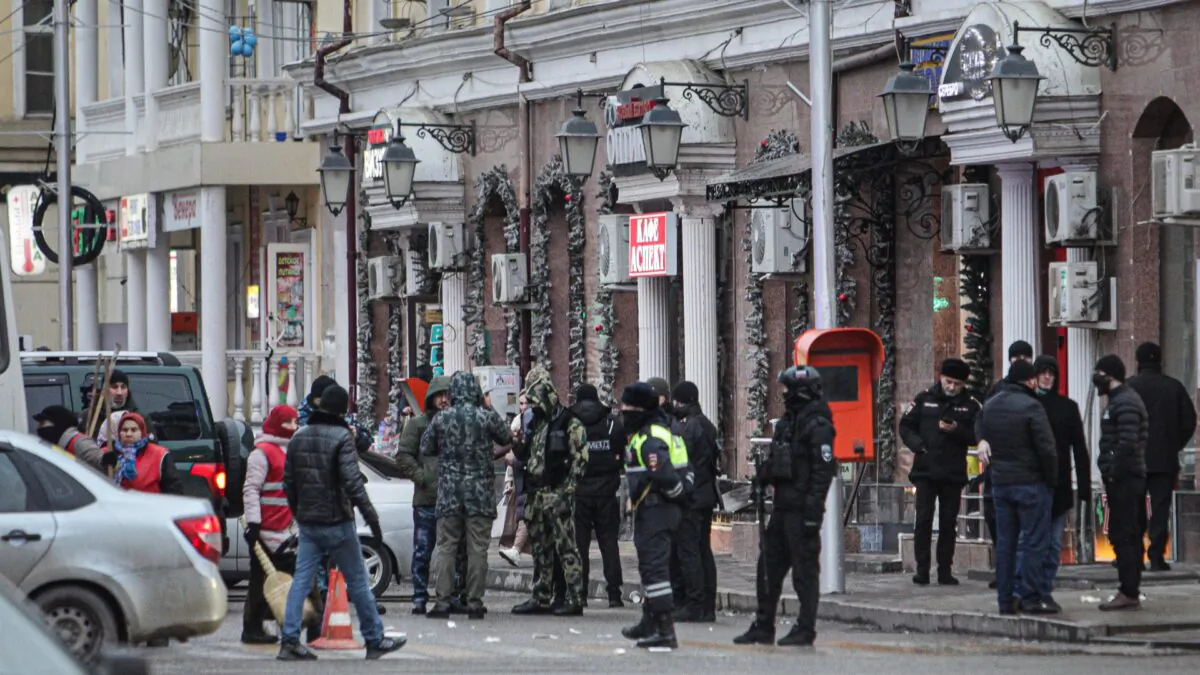 Police and investigators work at the scene after two men attacked road police in the center of the provincial capital, Grozny, Russia, on Dec. 28, 2020. (Musa Sadulayev/AP Photo)