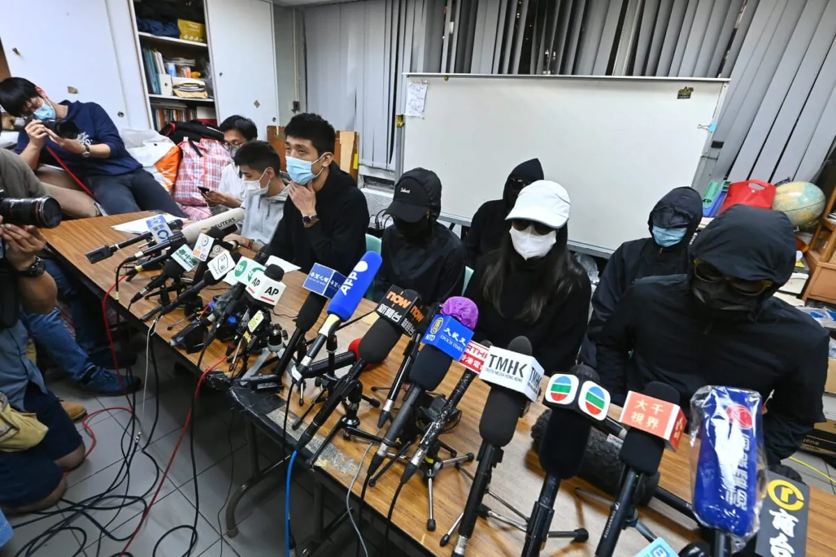 Family members of 12 Hong Kong residents detained in mainland China hold a press conference in Hong Kong on Dec. 28, 2020. (Song Bilung/The Epoch Times)