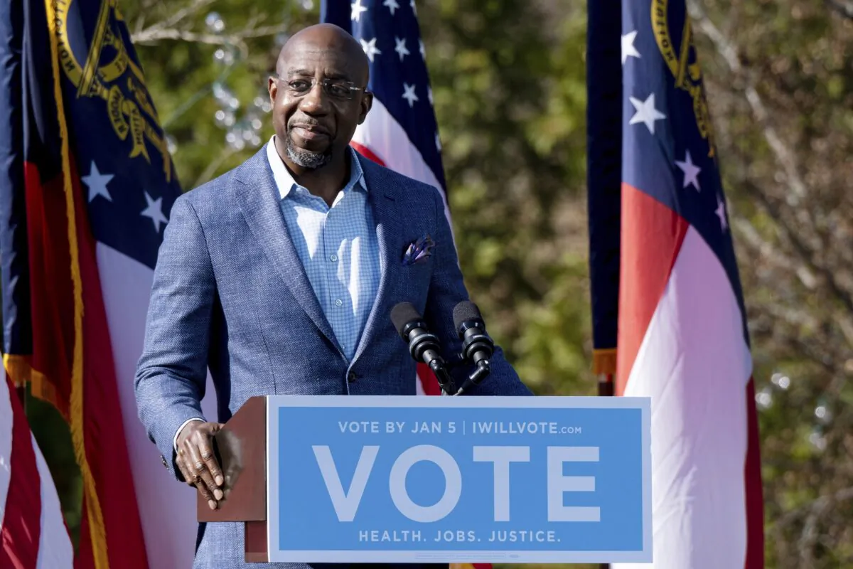 Georgia Democratic Senate candidate Rev. Raphael Warnock addresses the crowd during a drive-in rally at Bibb Mill Event Center in Columbus, Ga., on Dec. 21, 2020. (Ben Gray/AP Photo)