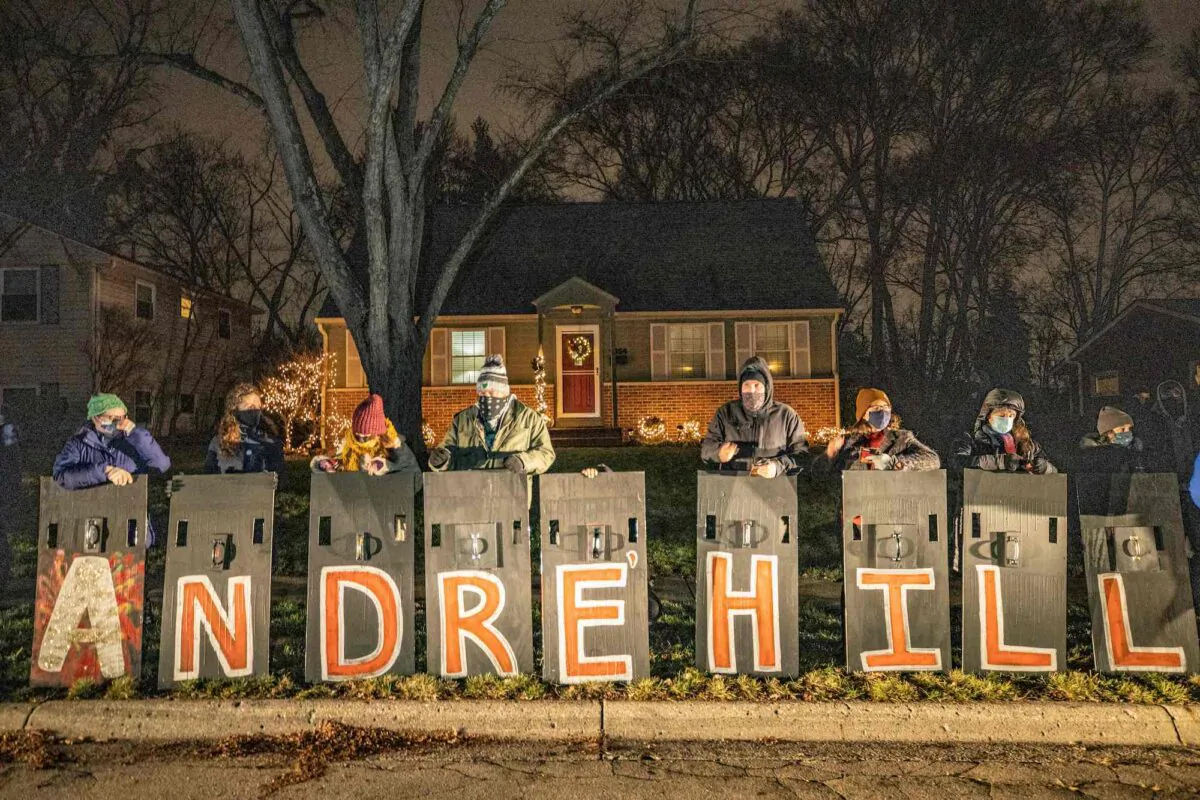 People hold signs spelling the name of Andre Hill, who was shot and killed by a police officer last week, as they participate in a demonstration in Columbus, Ohio, on Dec. 28, 2020. (Stephen Zenner/AFP/Getty Images)