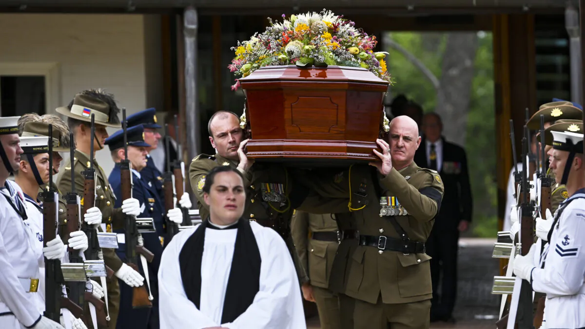 Members of the Australian Defence Force carry the coffin during a State funeral for Major General Michael Jeffery at the ANZAC Memorial Chapel of St Paul, Duntroon, Canberra, on Dec. 29, 2020. (Lukas Coch/AAP) 