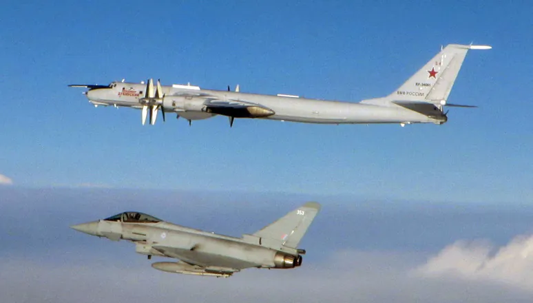 A British Royal Air Force Typhoon and Russian TU-142 Bear Maritime Patrol Aircraft bomber in a file photo. (UK Royal Air Force)