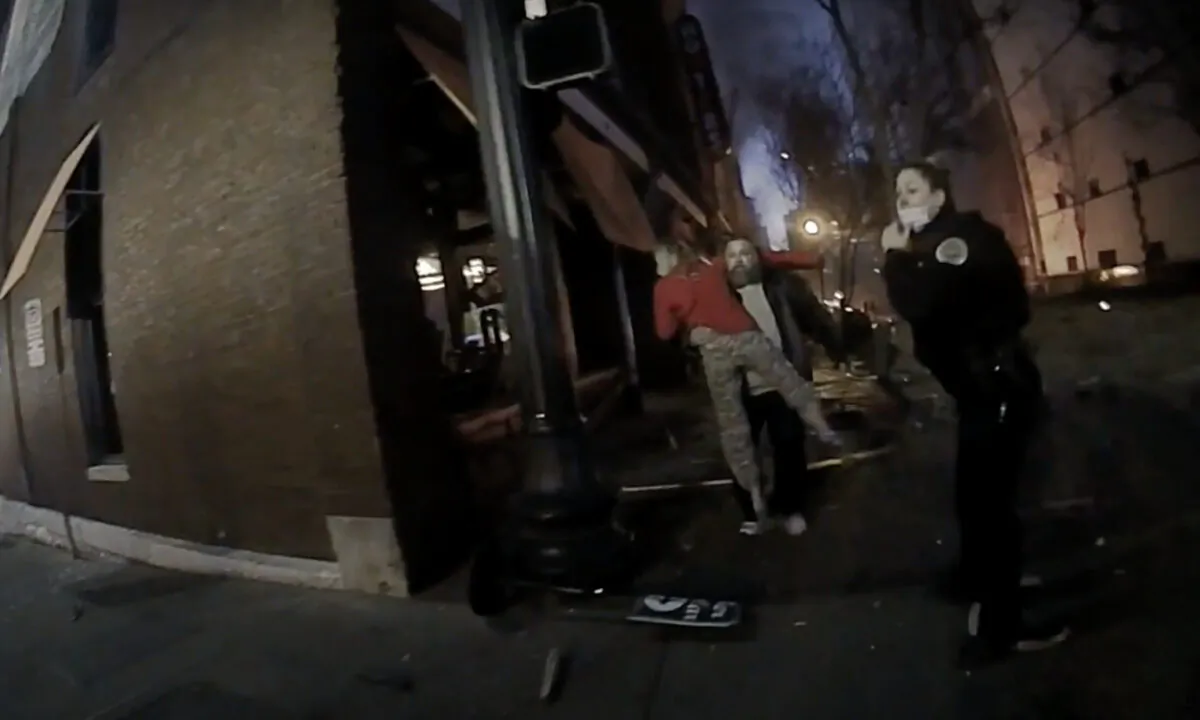 An officer checks in with people running to their after an explosion in Nashville on Christmas Day, 2020. (Screenshot/Nashville Police Department)