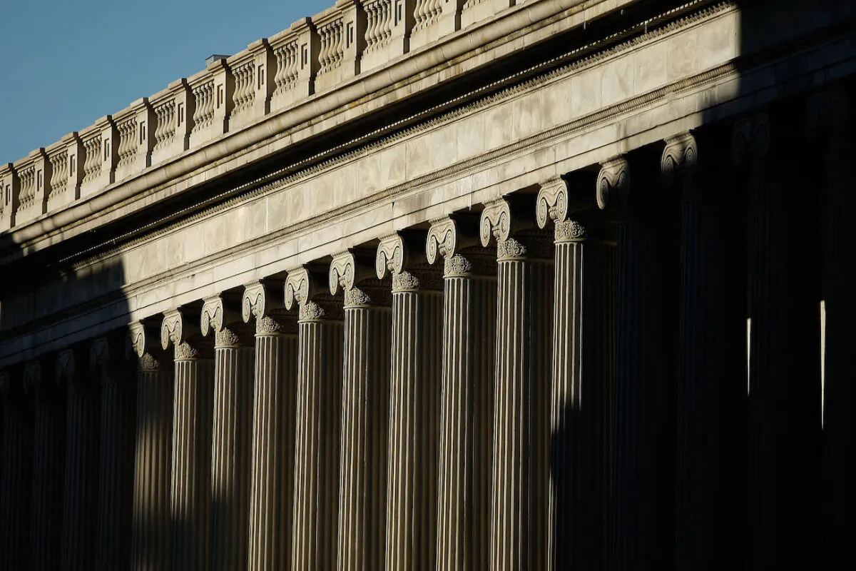 Sunshine breaks over the east side of the U.S. Treasury Department building in Washington, on March 23, 2009. (Chip Somodevilla/Getty Images)