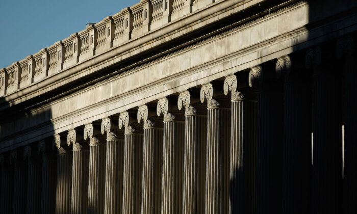 Sunshine breaks over the east side of the U.S. Treasury Department building in Washington, March 23, 2009. (Chip Somodevilla/Getty Images)