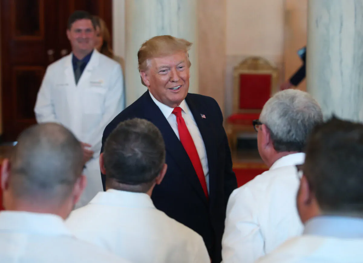 President Donald Trump greets healthcare workers after signing an executive order intended to improve quality and price transparency in healthcare during an event in the Grand Foyer of the White House in Washington, on June 24, 2019. (Mark Wilson/Getty Images)
