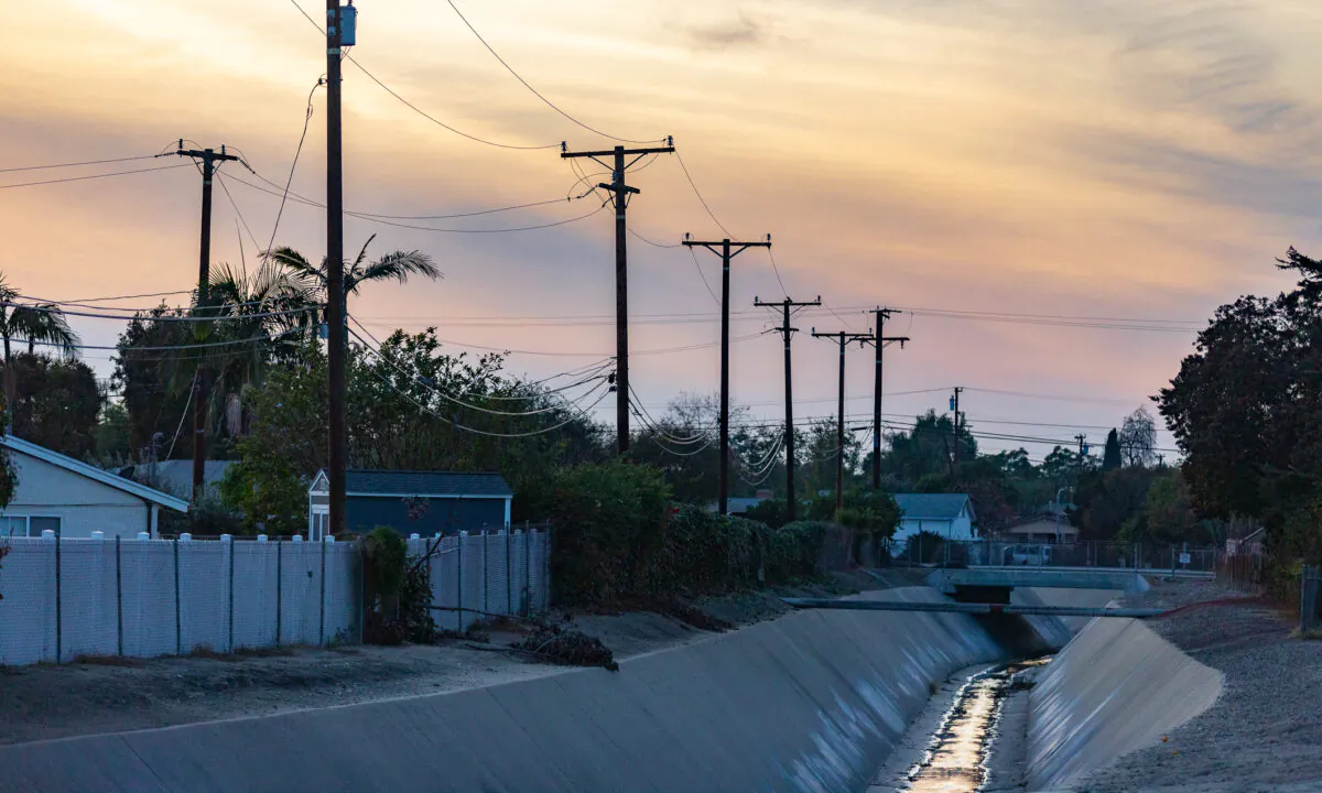 Water flows through a channel in Fullerton, Calif., on Dec. 22, 2020. (John Fredricks/The Epoch Times)
