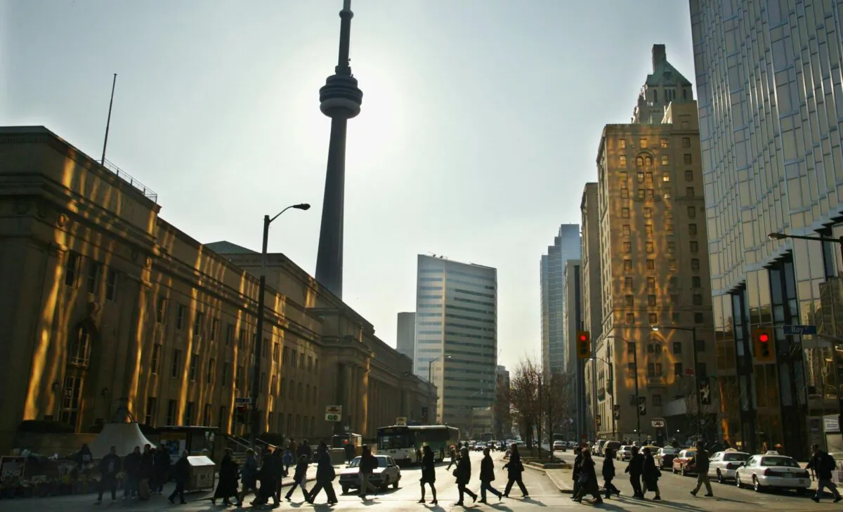 Pedestrians cross Bay Street, Canada’s financial district in downtown Toronto, in a file photo. (The Canadian Press/Kevin Frayer)