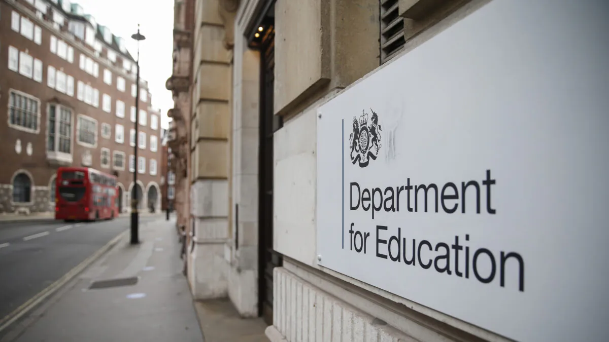 A London bus passes the Department for Education building in London on Dec. 28, 2020. (Hollie Adams/Getty Images)