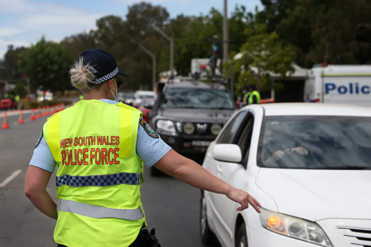 NSW police patrolling the Victorian border checkpoint in South Albury, Australia on November 22, 2020. (Lisa Maree Williams/Getty Images)