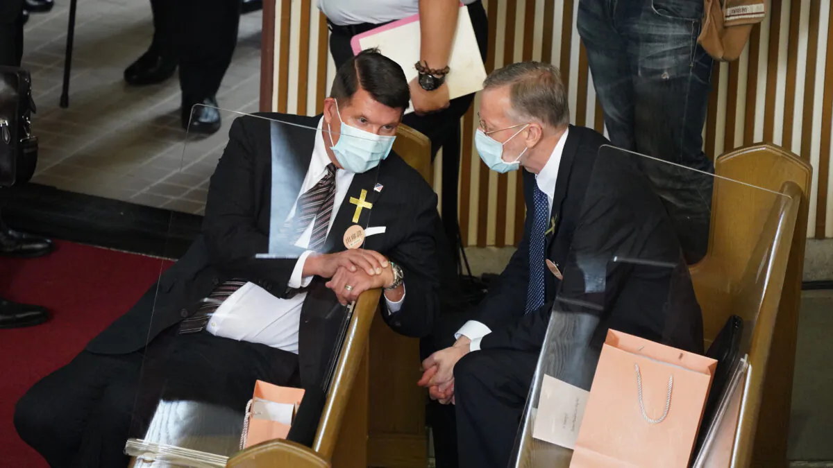 Keith Krach (L), U.S. undersecretary of state for economic growth, energy and the environment, speaks to Brent Christensen, director of the American Institute in Taiwan, during a funeral ceremony of former Taiwan president Lee Teng-hui at the Aletheia University in Nee Taipei City on Sept. 19, 2020. (HSU CHAO-CHANG/POOL/AFP via Getty Images)