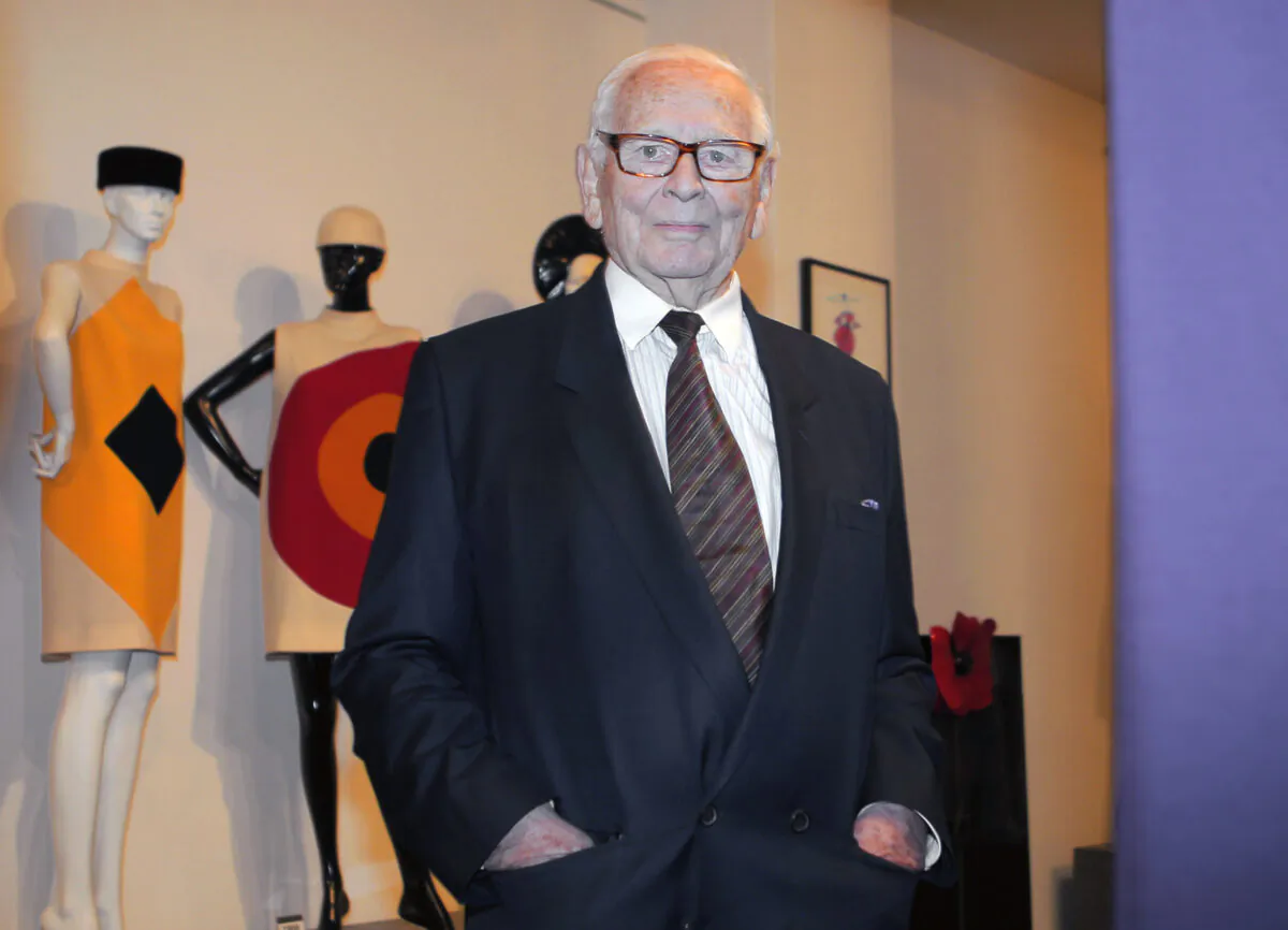 French fashion designer Pierre Cardin poses back-dropped by some of his designs during the inauguration of the Pierre Cardin Museum in Paris, France, on Nov. 13, 2014. (Jacques Brinon/AP Photo)