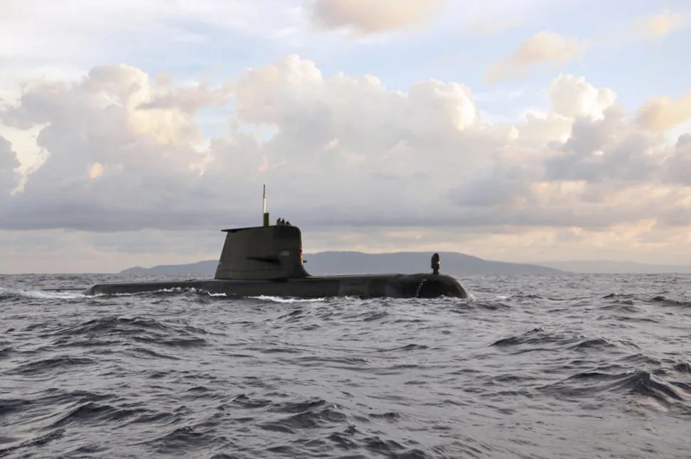 The Royal Australian Navy Collins Class Submarine HMAS Sheean passes Christmas Island on her way to Singapore for a major regional exercise (ABPH Joanne Edwards/ Supplied)