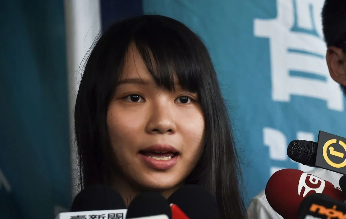 Pro-democracy activist Agnes Chow speaks to the press after she was released on bail at the Eastern Magistrates Courts in Hong Kong on August 30, 2019. (Lillian Suwanrumpha/AFP via Getty Images)