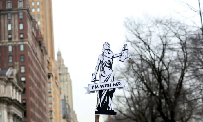  A sign reads "I'm with her" as people participate in the annual Women's March on Jan. 18, 2020 in New York City. (Yana Paskova/Getty Images)