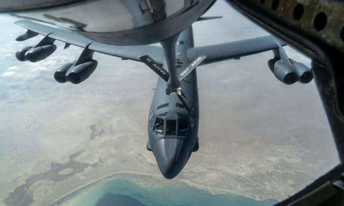 A U.S. Air Force B-52 from Barksdale Air Force Base is aerial refueled by a KC-135 Stratotanker over the U.S. Central Command area of responsibility on Dec. 30, 2020. (U.S. Air Force photo by Senior Airman Roslyn Ward)