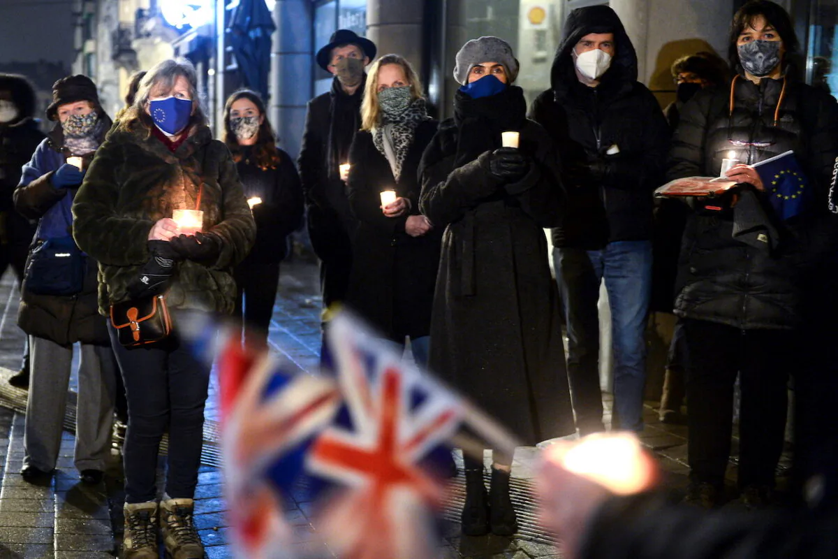 British people living in Brussels who oppose Brexit hold a candlelit vigil outside the British embassy as the transition period comes to an end in Brussels, Belgium, on Dec. 31, 2020. (Johanna Geron/Reuters)