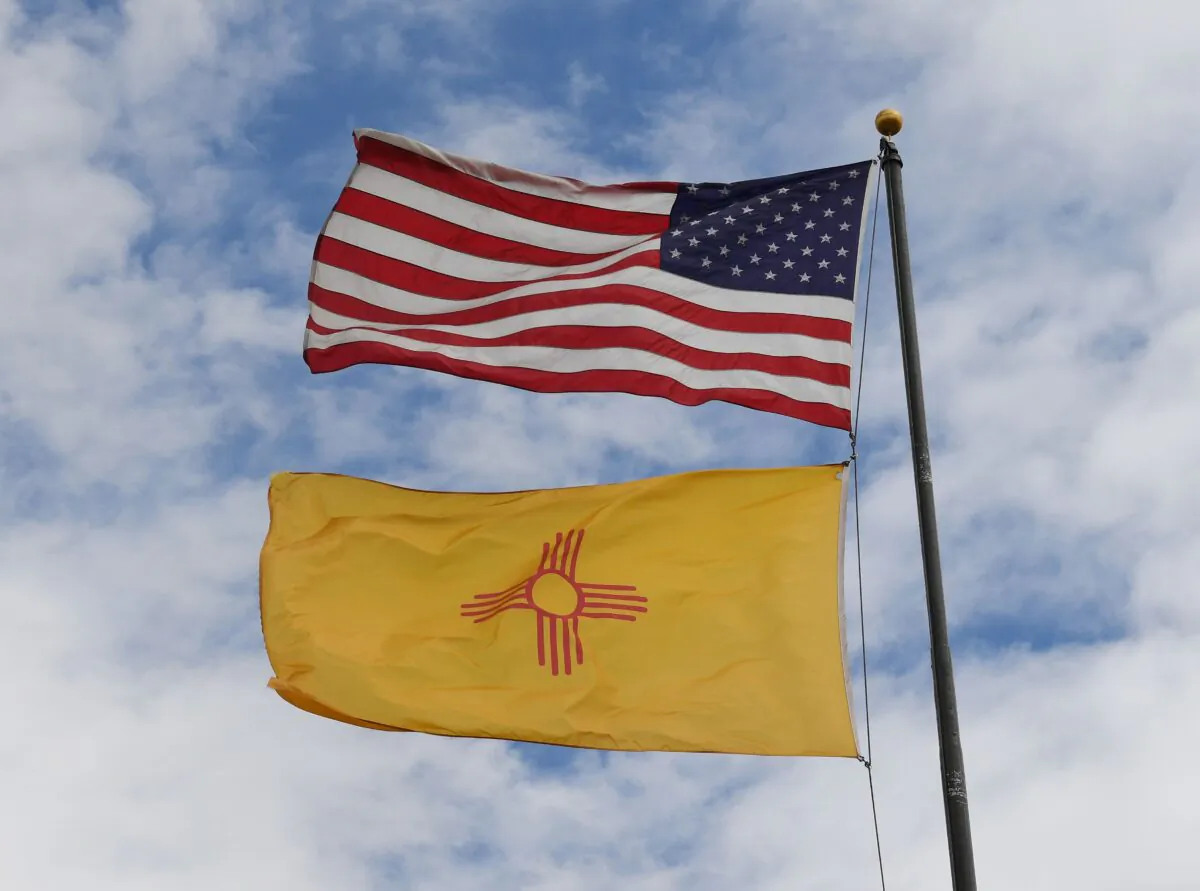 The U.S. and New Mexico flags fly in Albuquerque, N.M., on Oct. 1, 2018. (Mark Ralston/AFP/Getty Images)